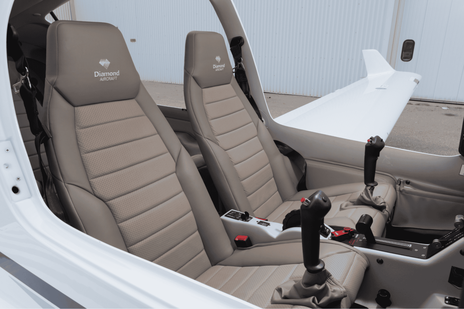 Diamond Aircraft cockpit interior with seats and controls.