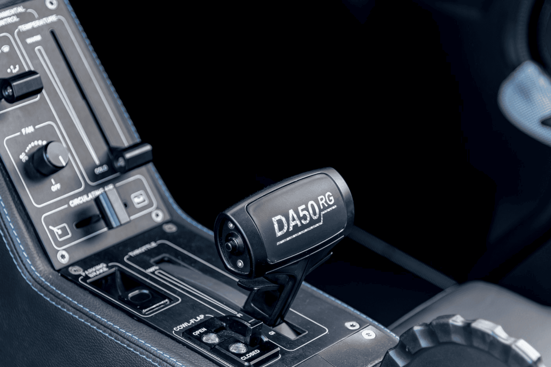 Aircraft cockpit throttle labeled DA50RG
