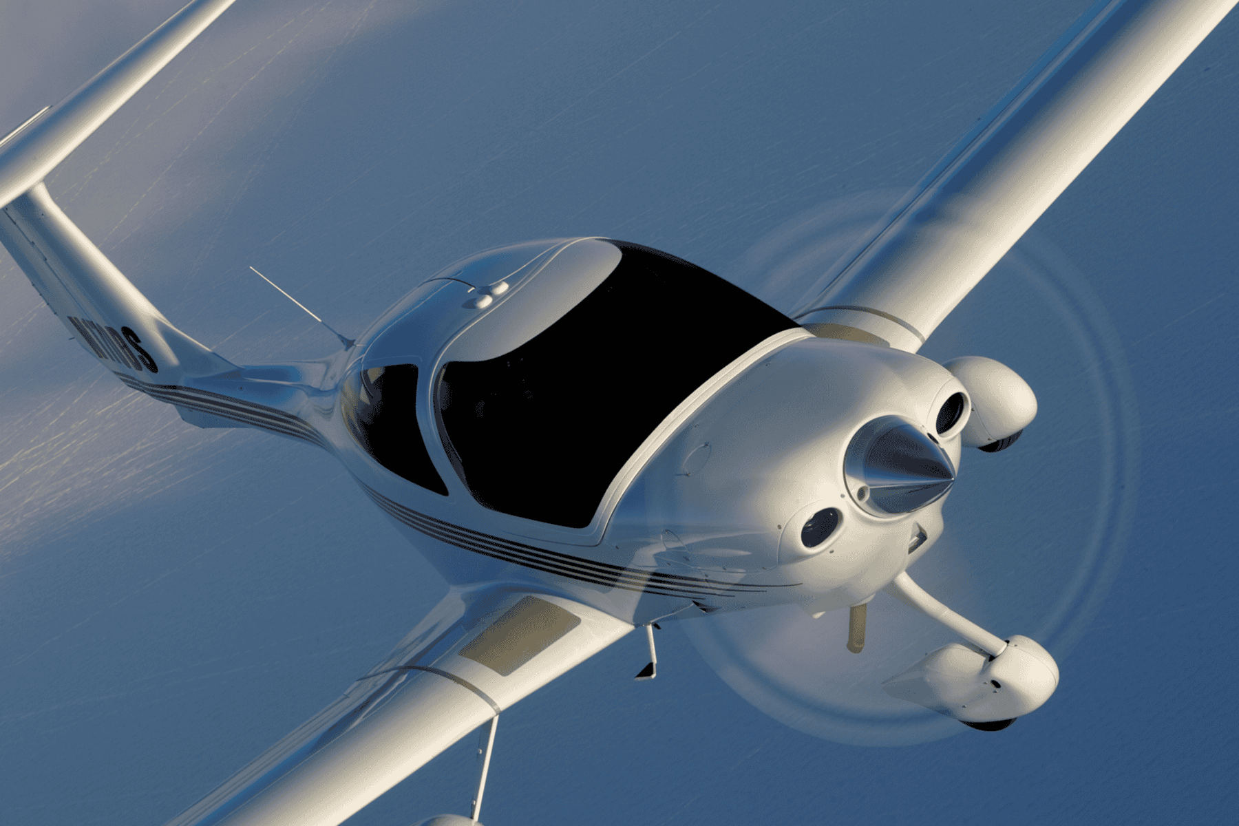 Small white airplane flying in sky