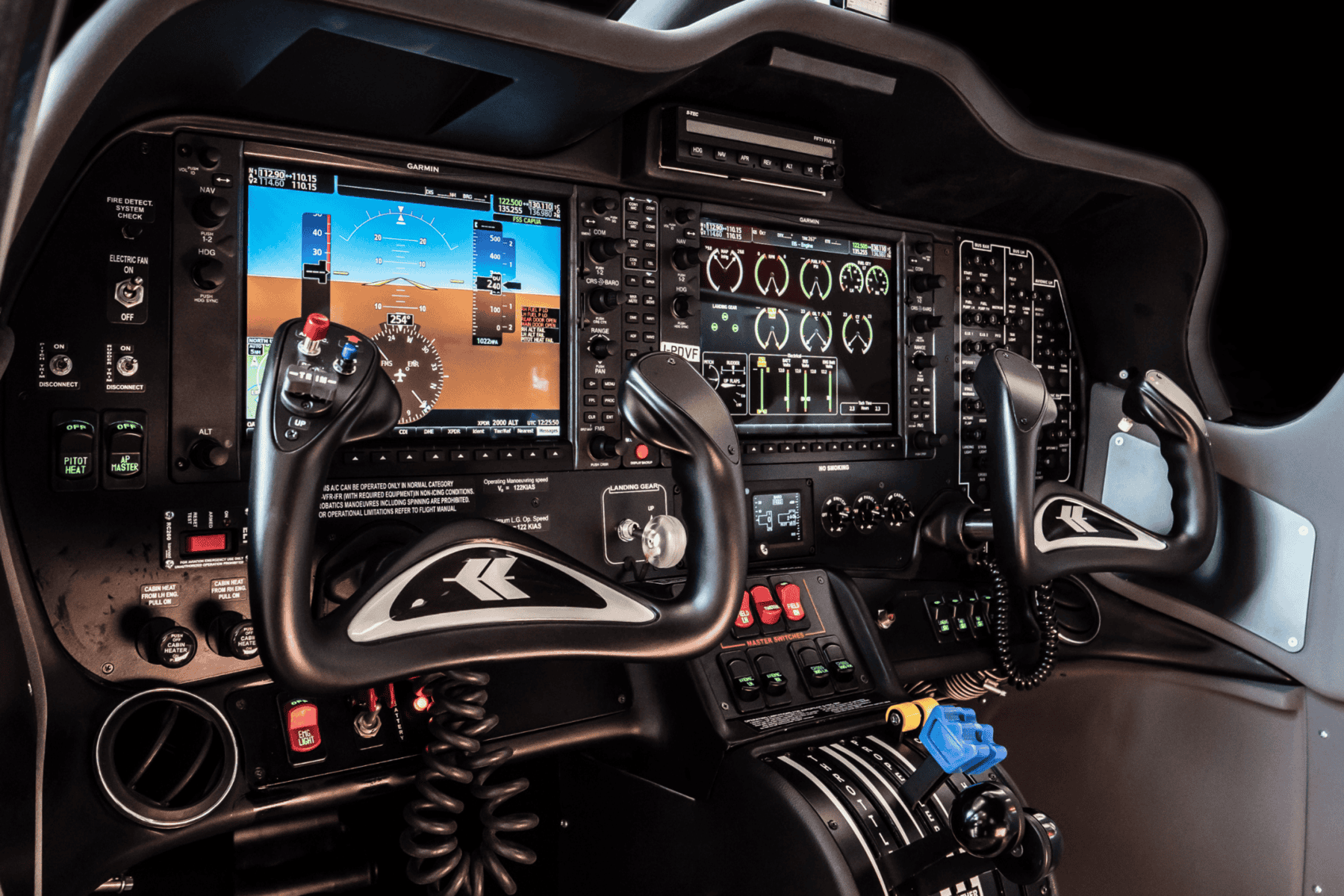 Aircraft cockpit with control instruments and displays.