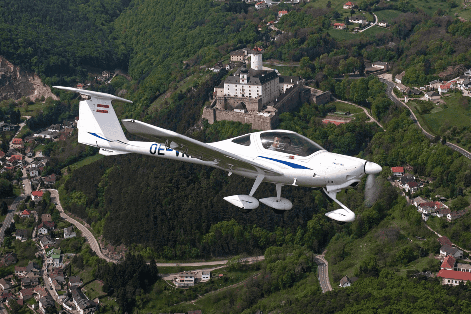 Small plane flying over scenic landscape