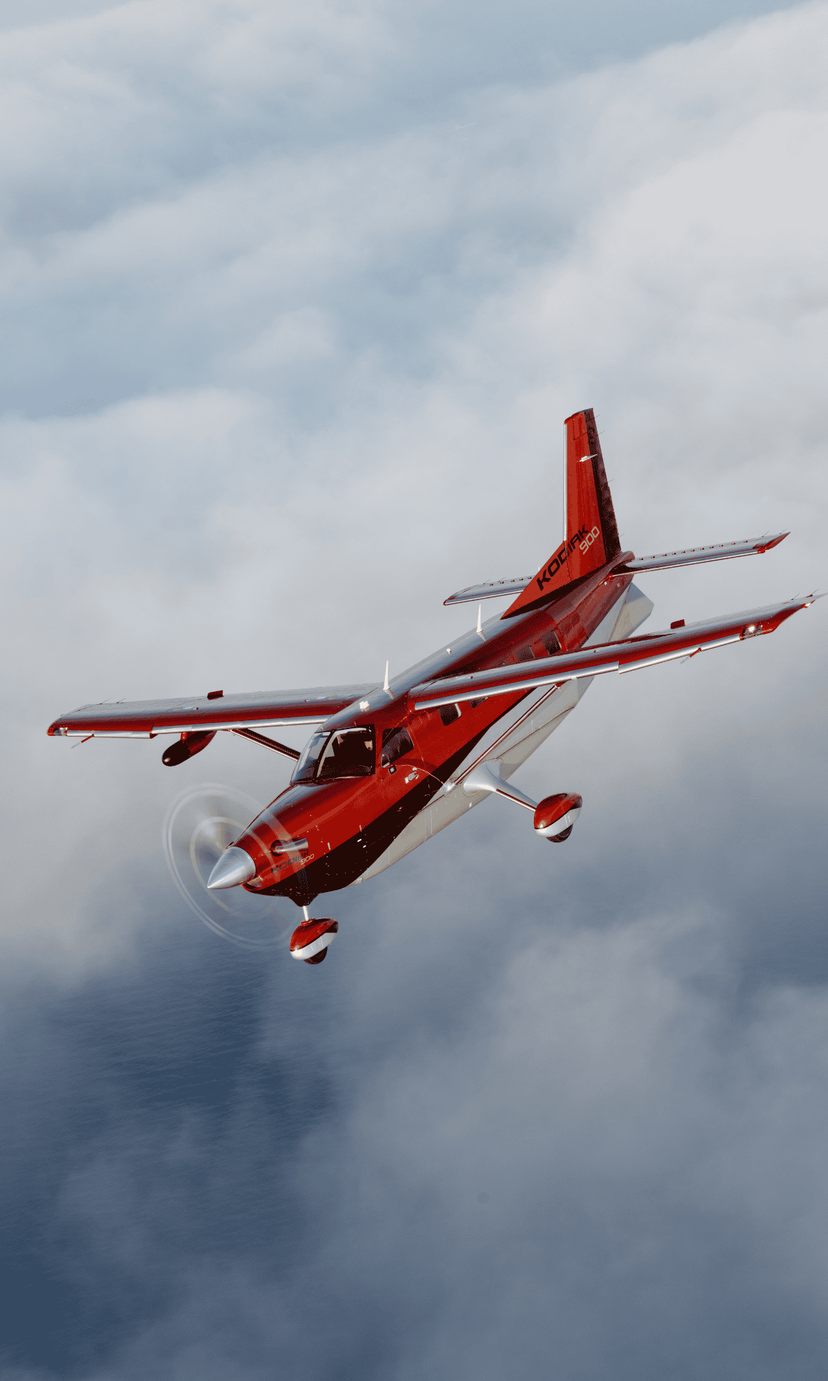 Red airplane flying above the clouds