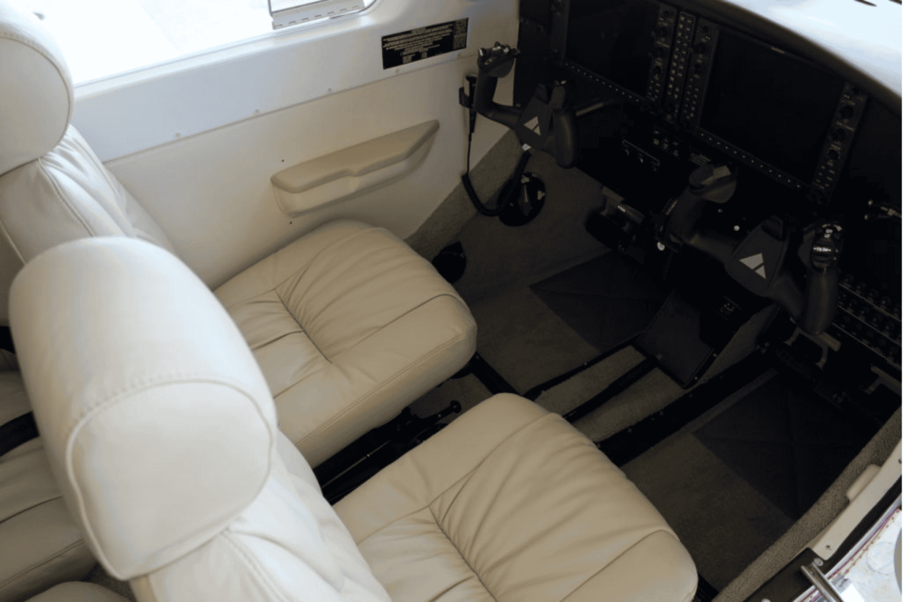 Cockpit with beige seats and controls