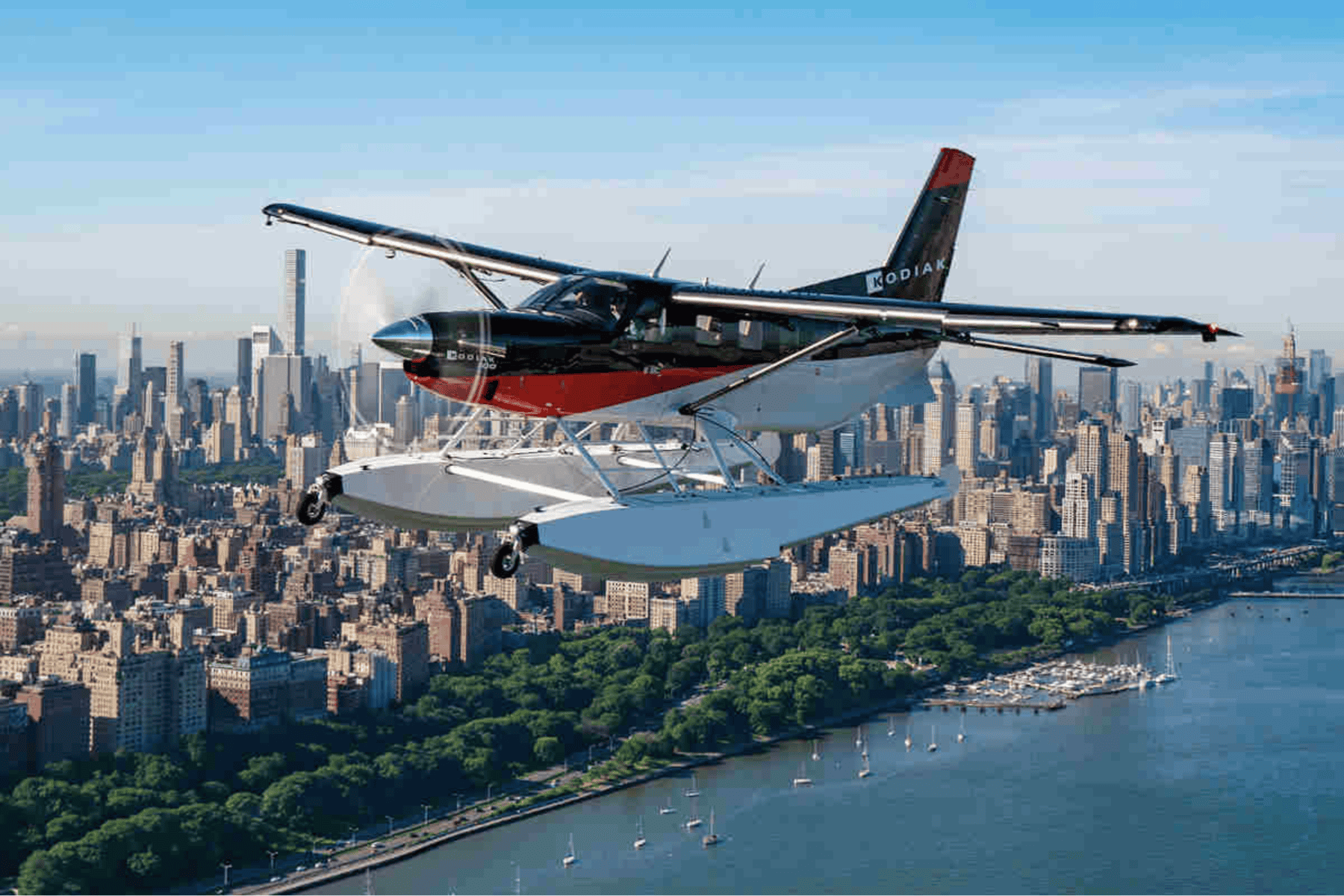 Seaplane flying over New York City skyline