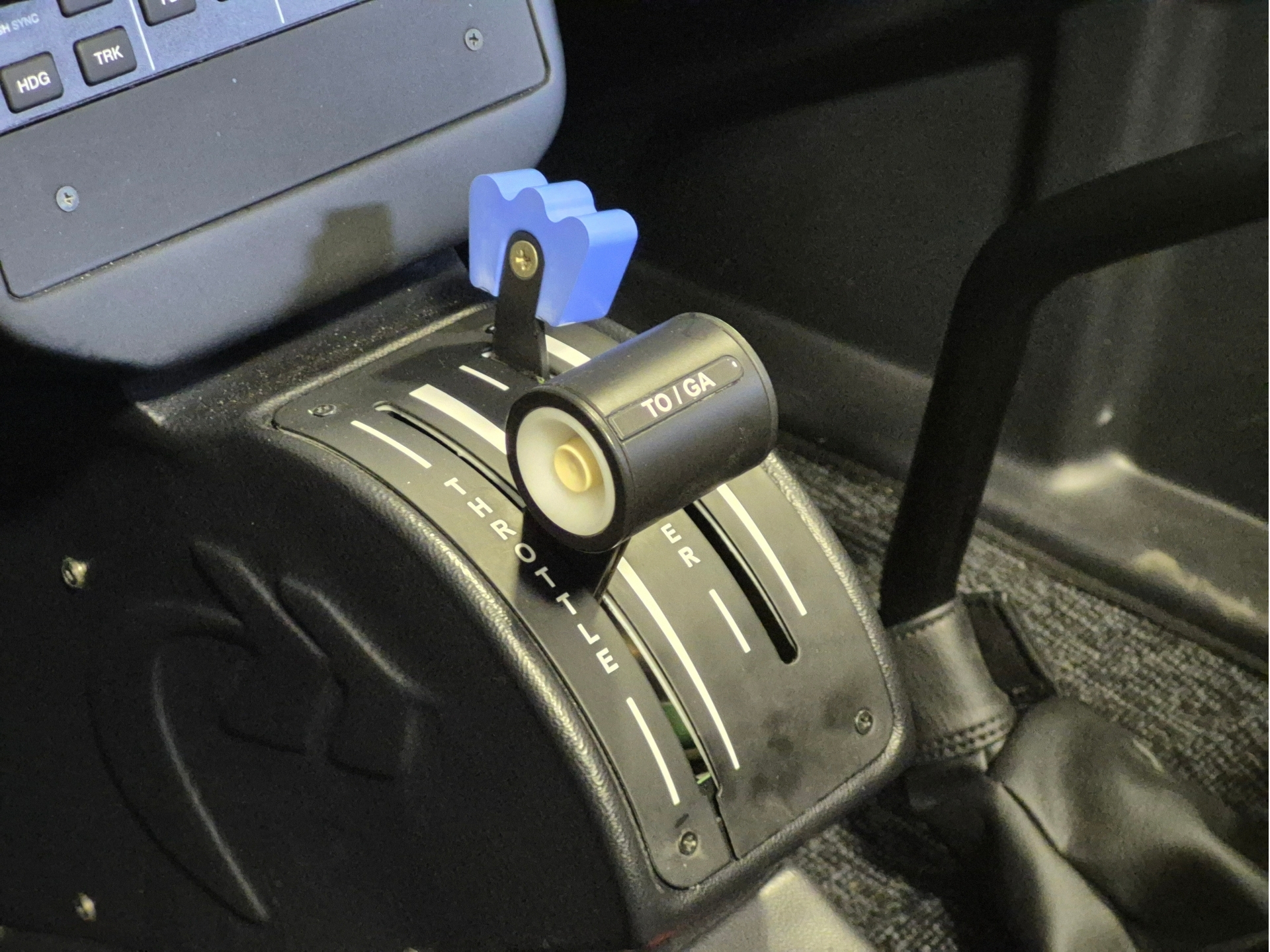 Automatic gear selector with a blue decorative lever in a car interior, showing PRND markings on the center console